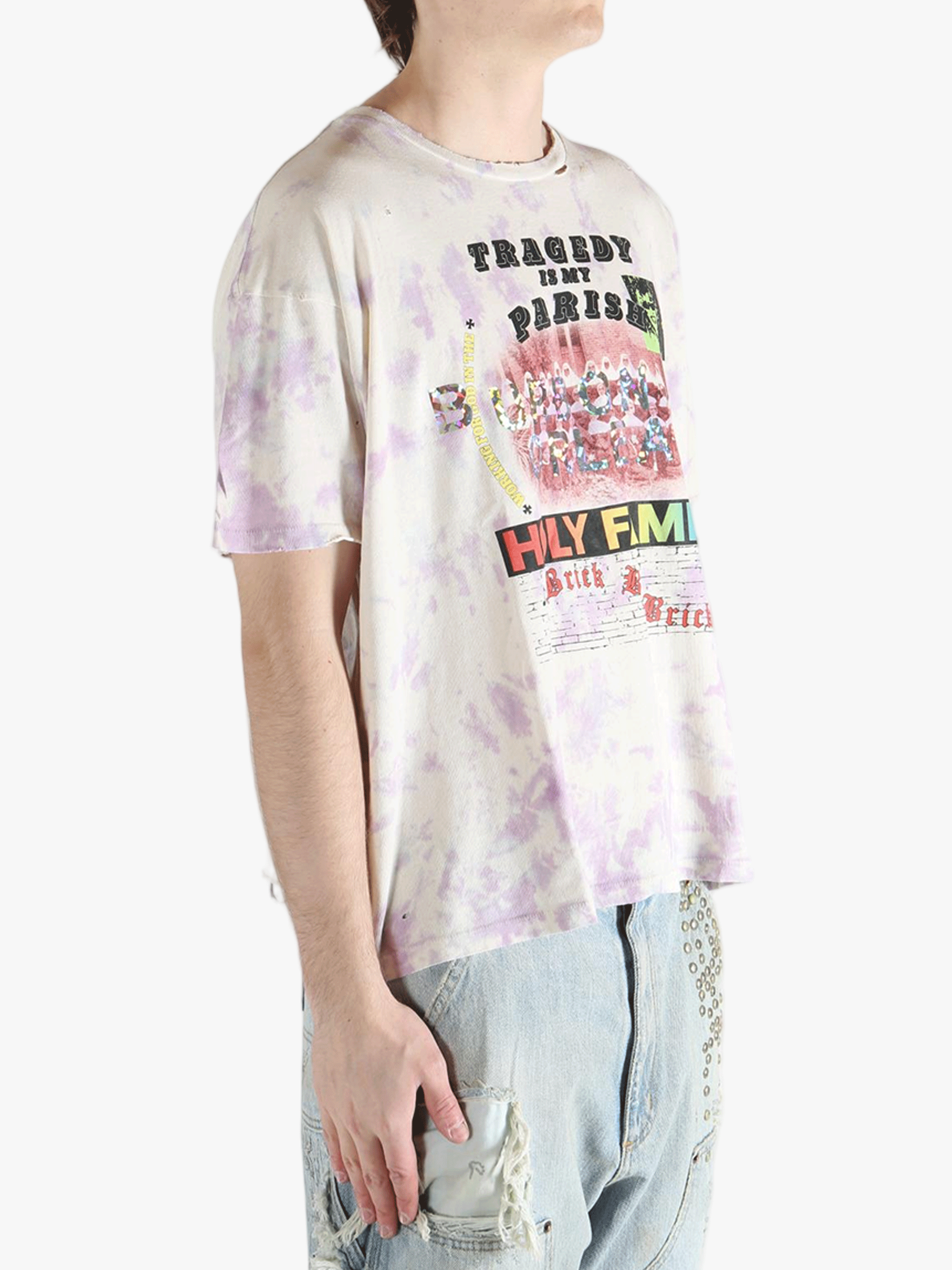 White t-shirt worn by a person, showing the shirt's fit