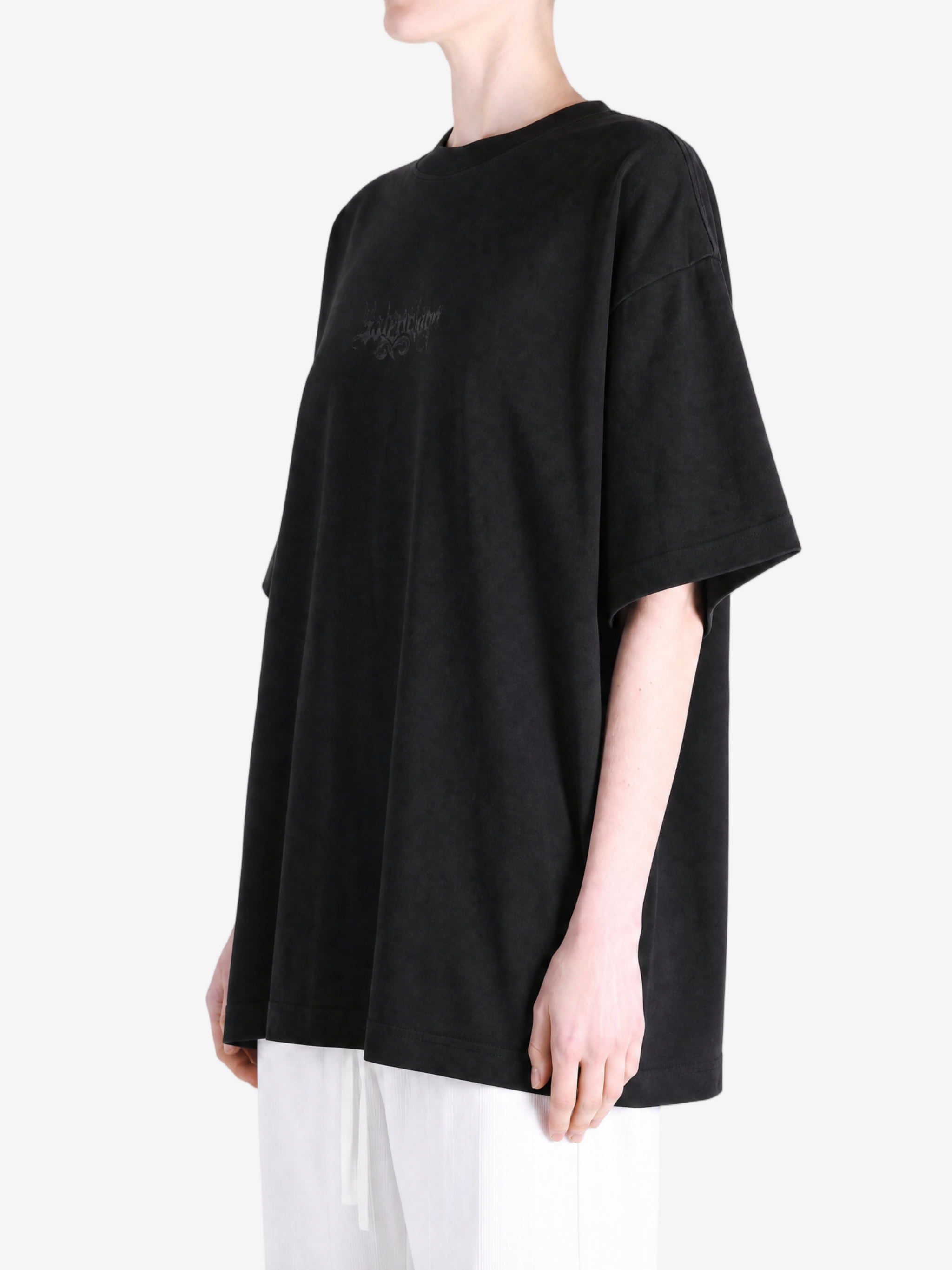 Black t-shirt worn by a person, showing the t-shirt fit