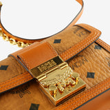 Close up of brown bag, showing texture of the leather  fabric