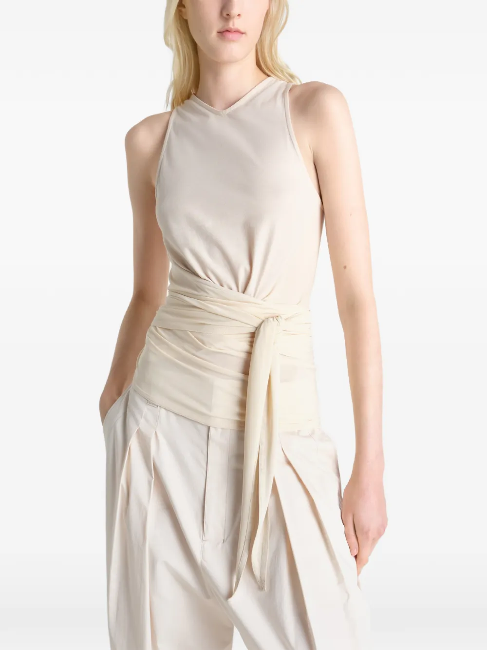 Tan top worn by a person, showing the top fit
