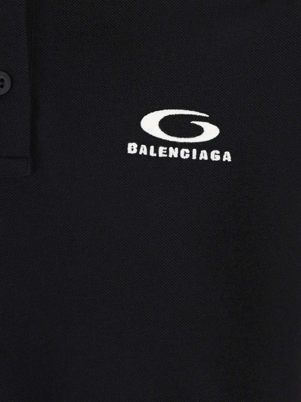 Close up of black t-shirt, showing the texture of the cotton fabric
