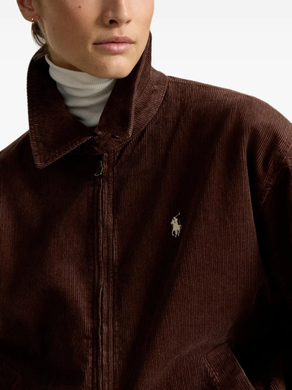 Brown jacket worn by a person, showing the jacket fit