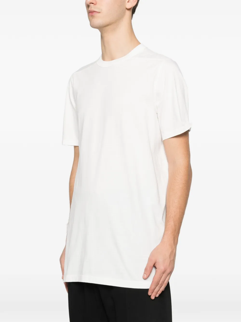 White t-shirt worn by a person, showing the t-shirt fit
