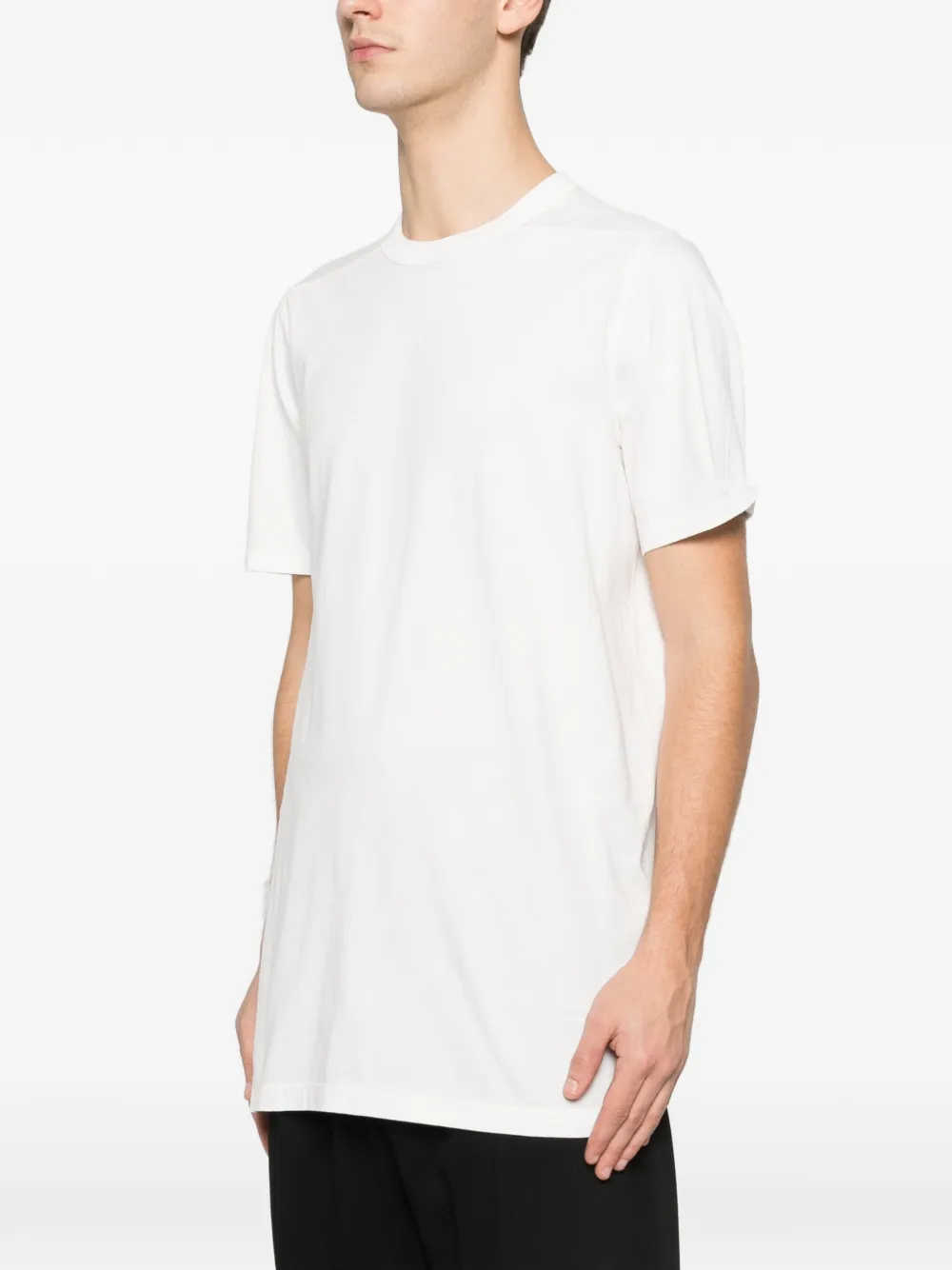 White t-shirt worn by a person, showing the t-shirt fit
