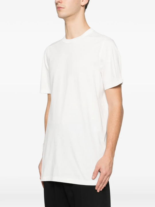 White t-shirt worn by a person, showing the t-shirt fit
