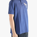 Blue polo shirt worn by a person, showing the shirt's fit