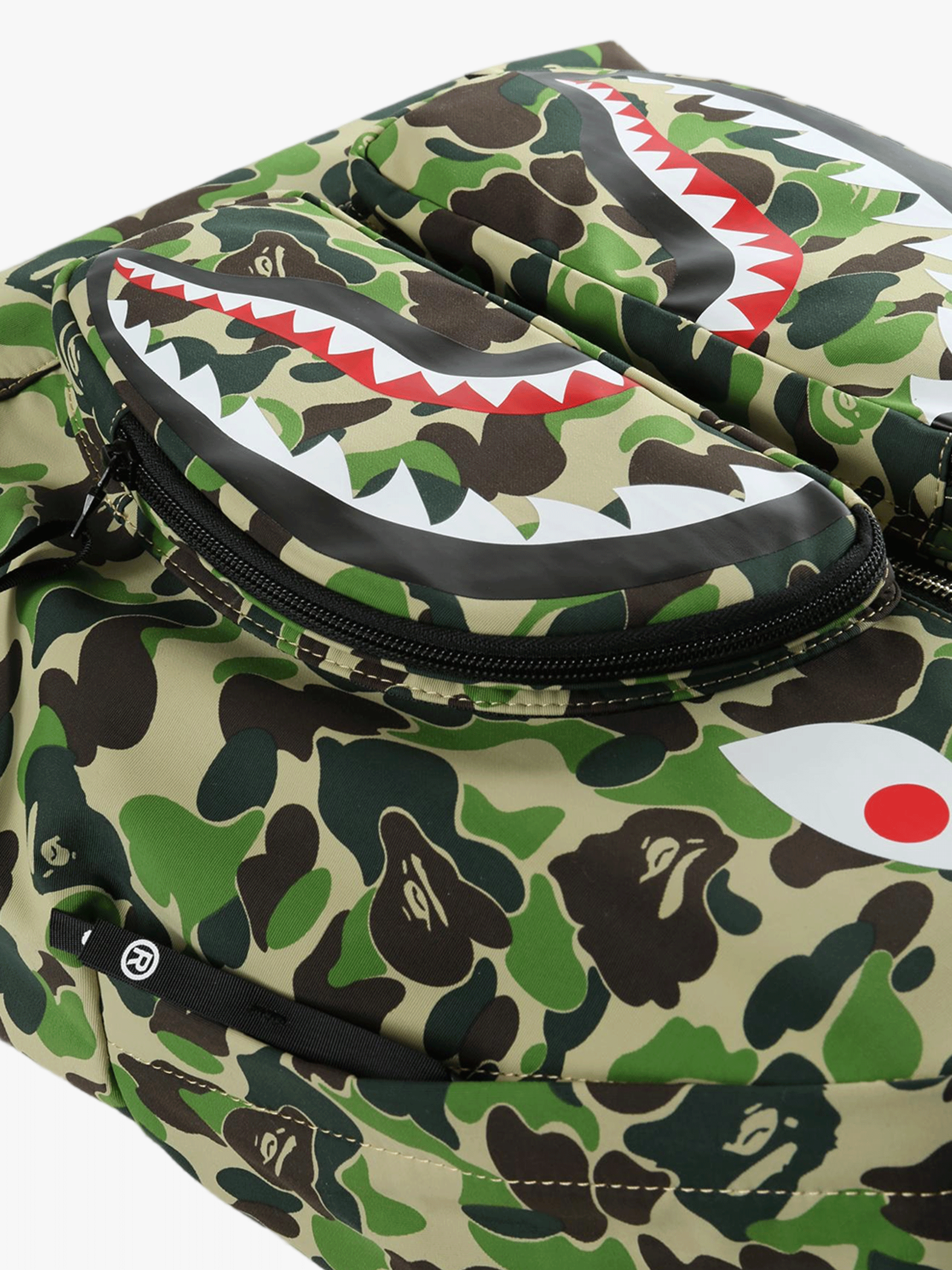 Close up of green bag, showing texture of the nylon fabric