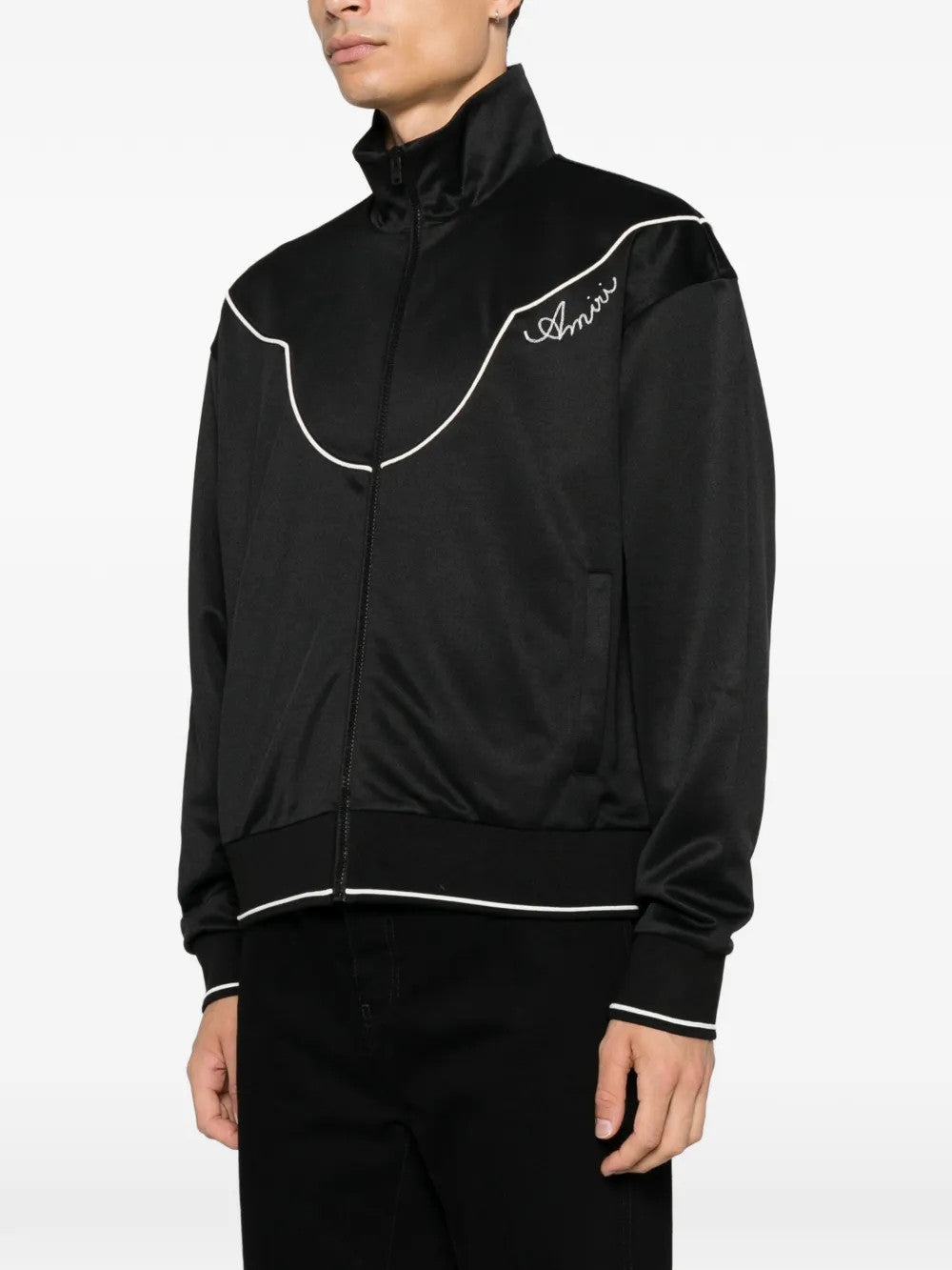Black jacket worn by a person, showing the jacket fit