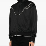 Black jacket worn by a person, showing the jacket fit
