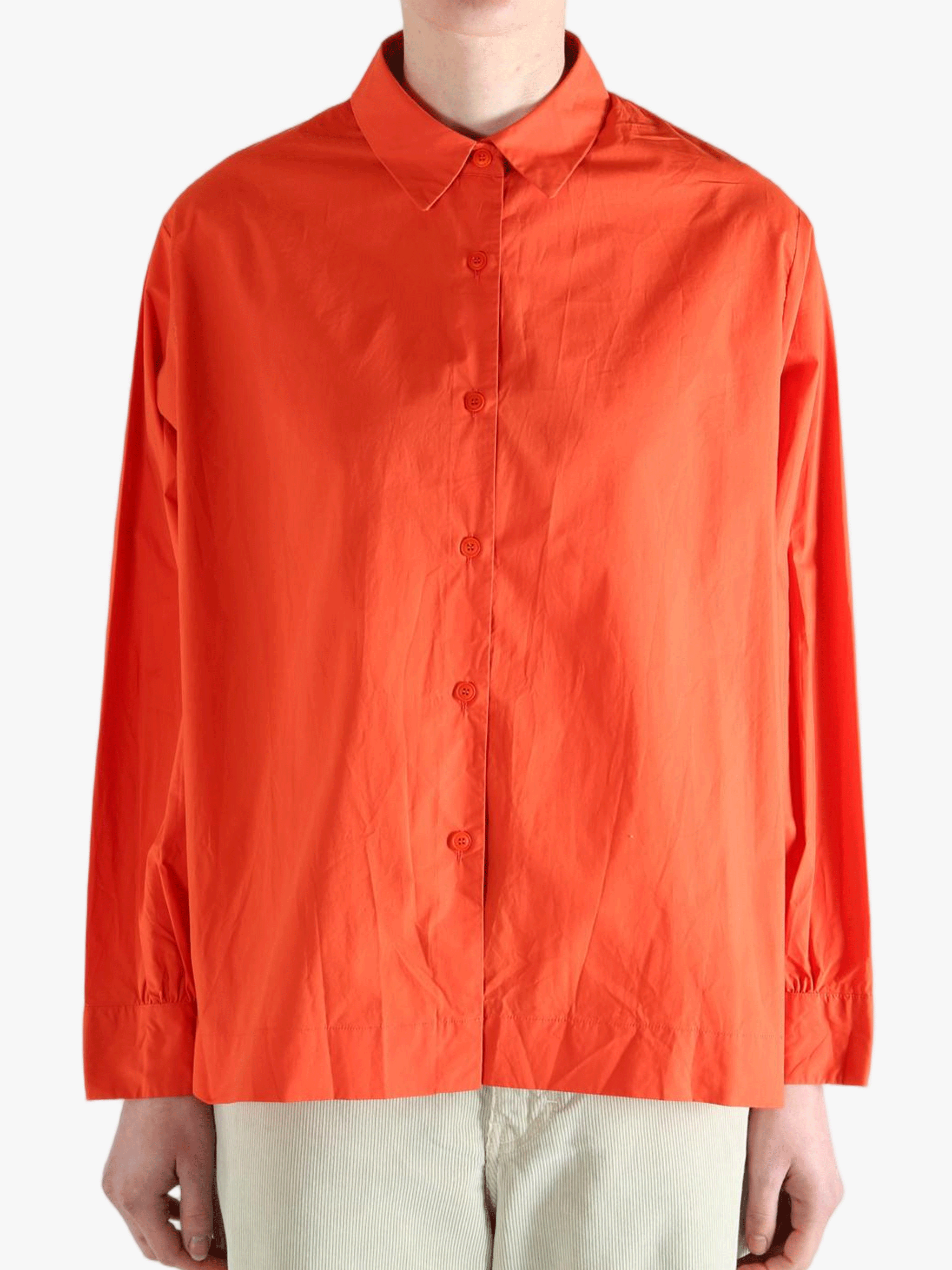 Red shirt worn by a person, showing the shirt's fit