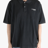 Black t-shirt worn by a person, showing the cotton fit