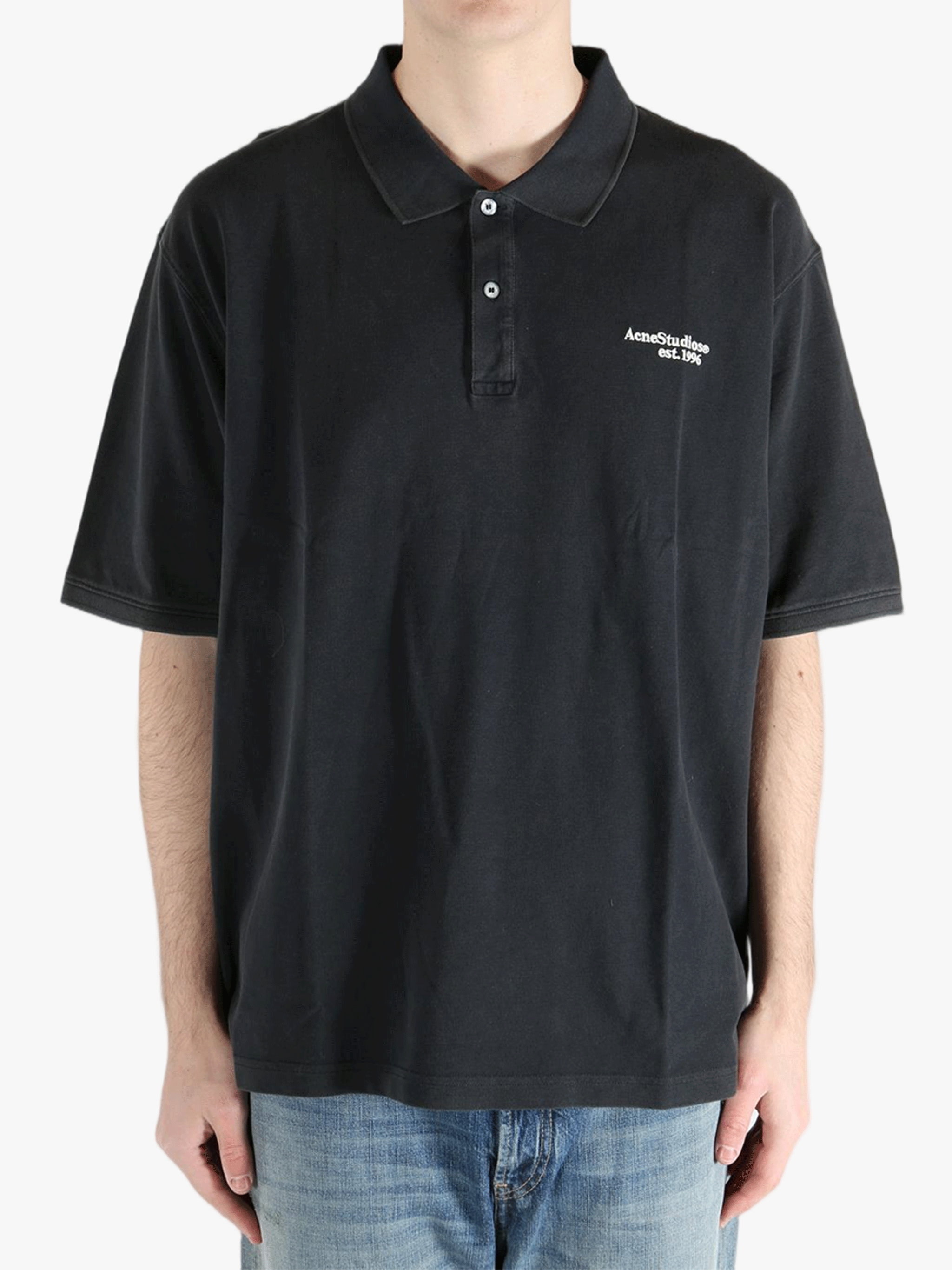 Black t-shirt worn by a person, showing the cotton fit