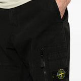 Black pants worn by a person, showing the pants fit