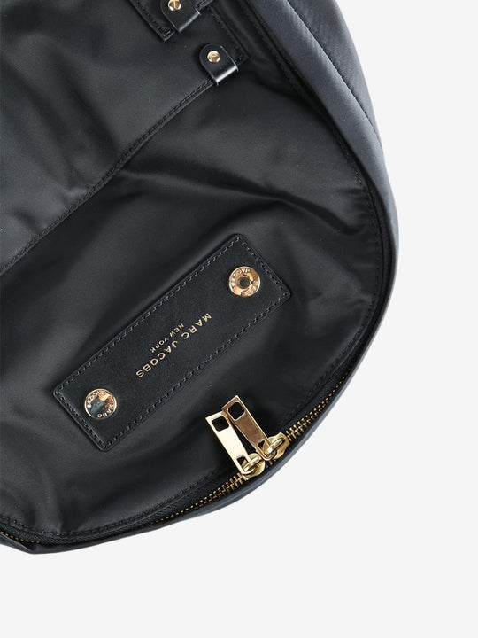 Close up of the black bag, showing texture of the polyester fabric