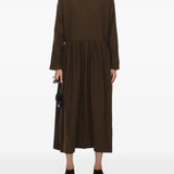 Brown dress worn by a person, showing the dress's fit