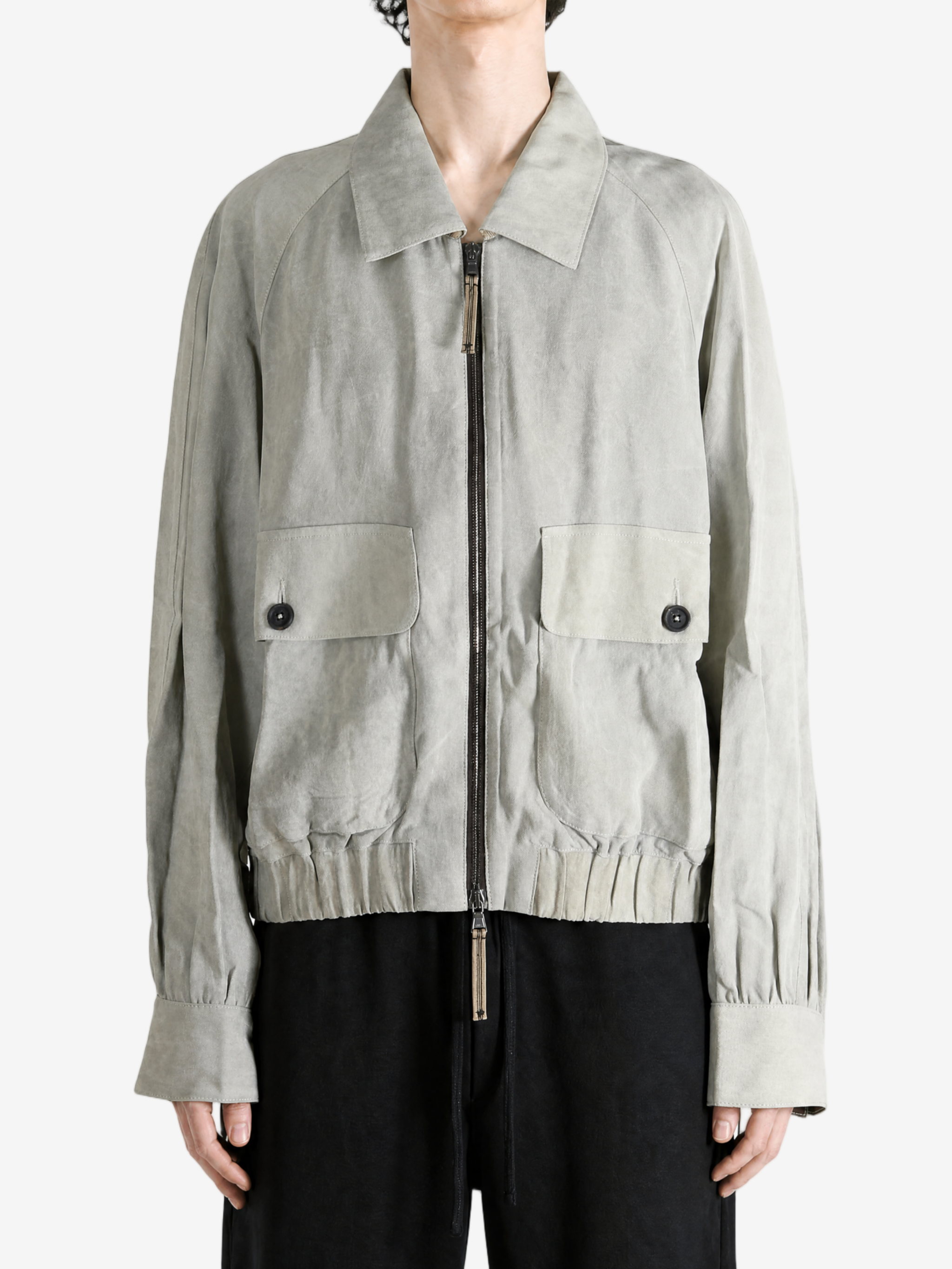 Grey jacket worn by a person, showing the jacket fit