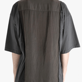 Brown shirt worn by a person, showing the shirt's fit