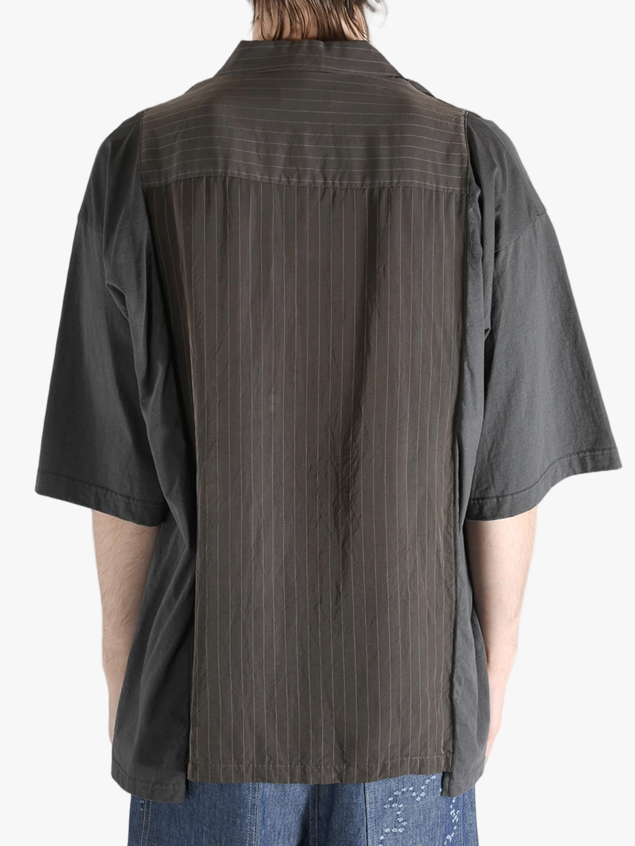 Brown shirt worn by a person, showing the shirt's fit