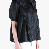 Black t-shirt worn by a person, showing the t-shirt's fit