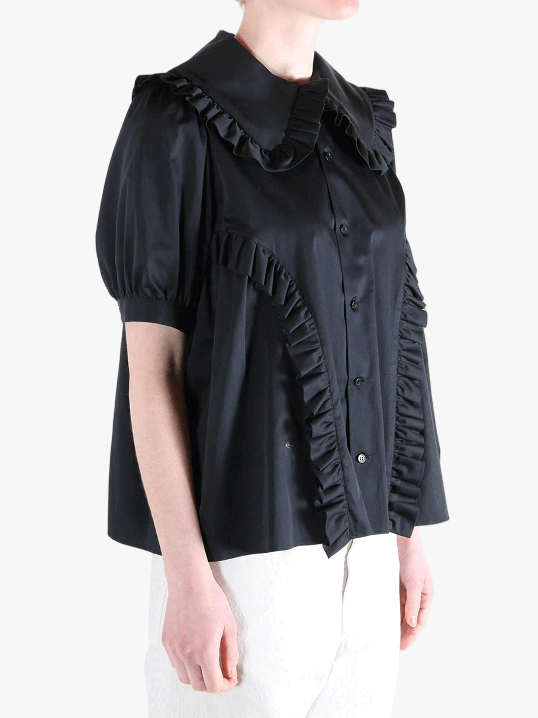 Black t-shirt worn by a person, showing the t-shirt's fit