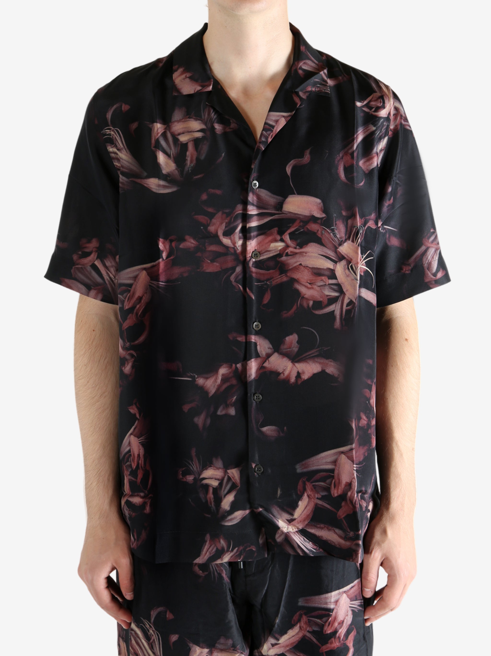 Black shirt worn by a person, showing the shirt's fit