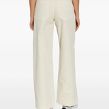 tan pants worn by a person, showing the pants fit