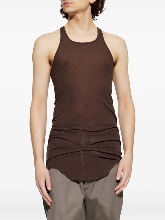 Brown tops worn by a person, showing the tops fit
