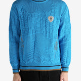 Blue jumper worn by a person, showing the jumper's fit