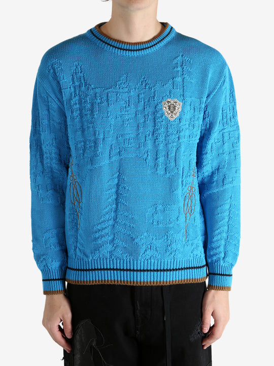 Blue jumper worn by a person, showing the jumper's fit