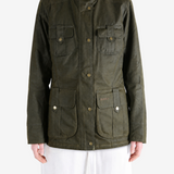 Green jacket worn by a person, showing the jacket fit
