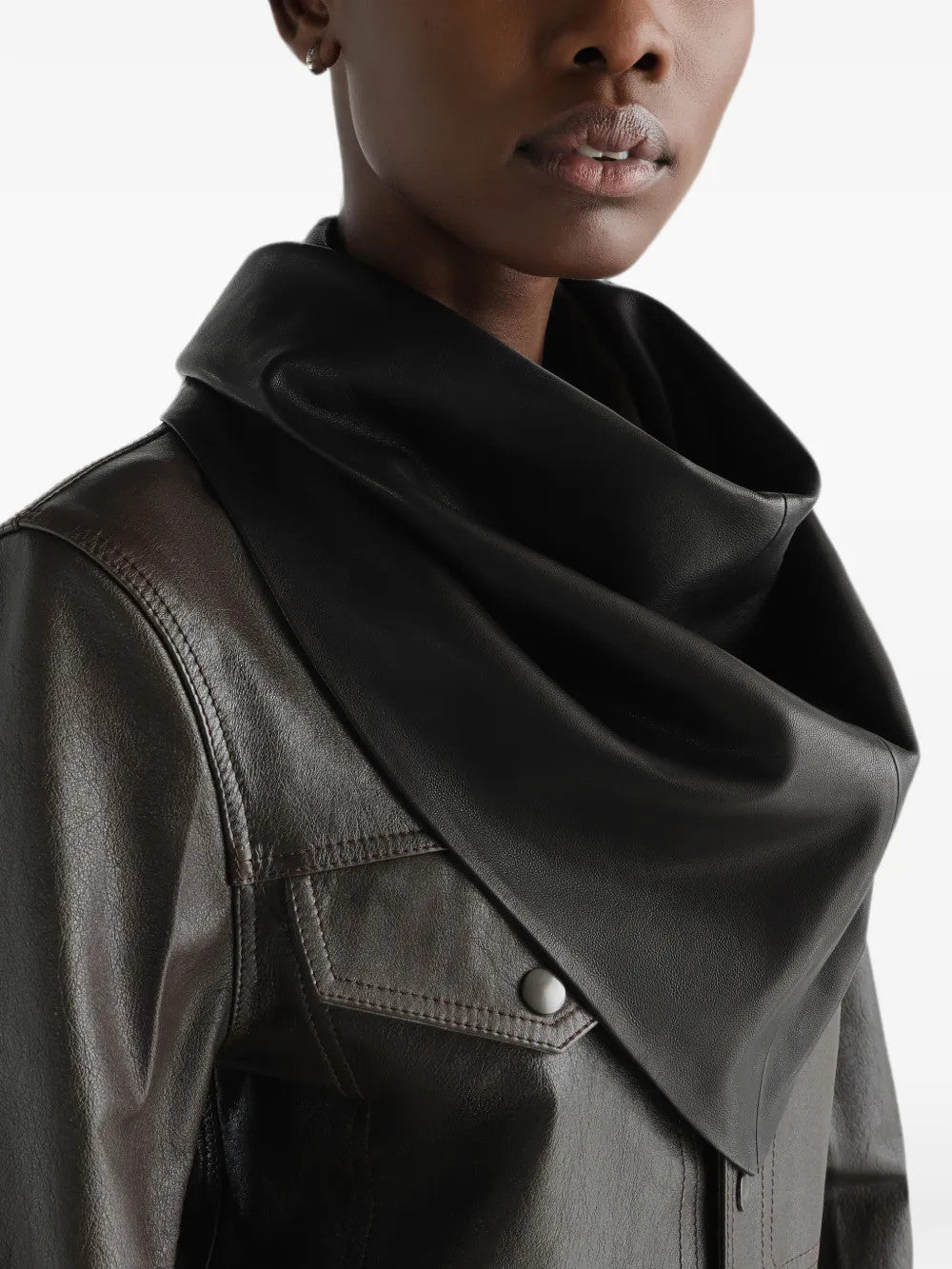Black scarf worn by a person, showing the scarf fit