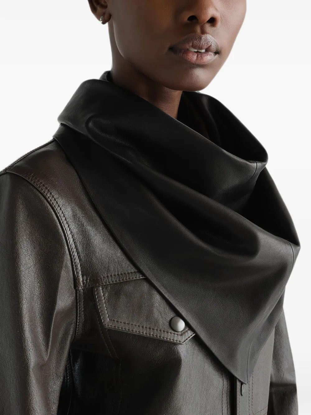 Black scarf worn by a person, showing the scarf fit