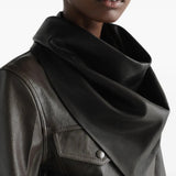 Black scarf worn by a person, showing the scarf fit
