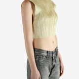 green pleated top worn by a person, showing the top fit