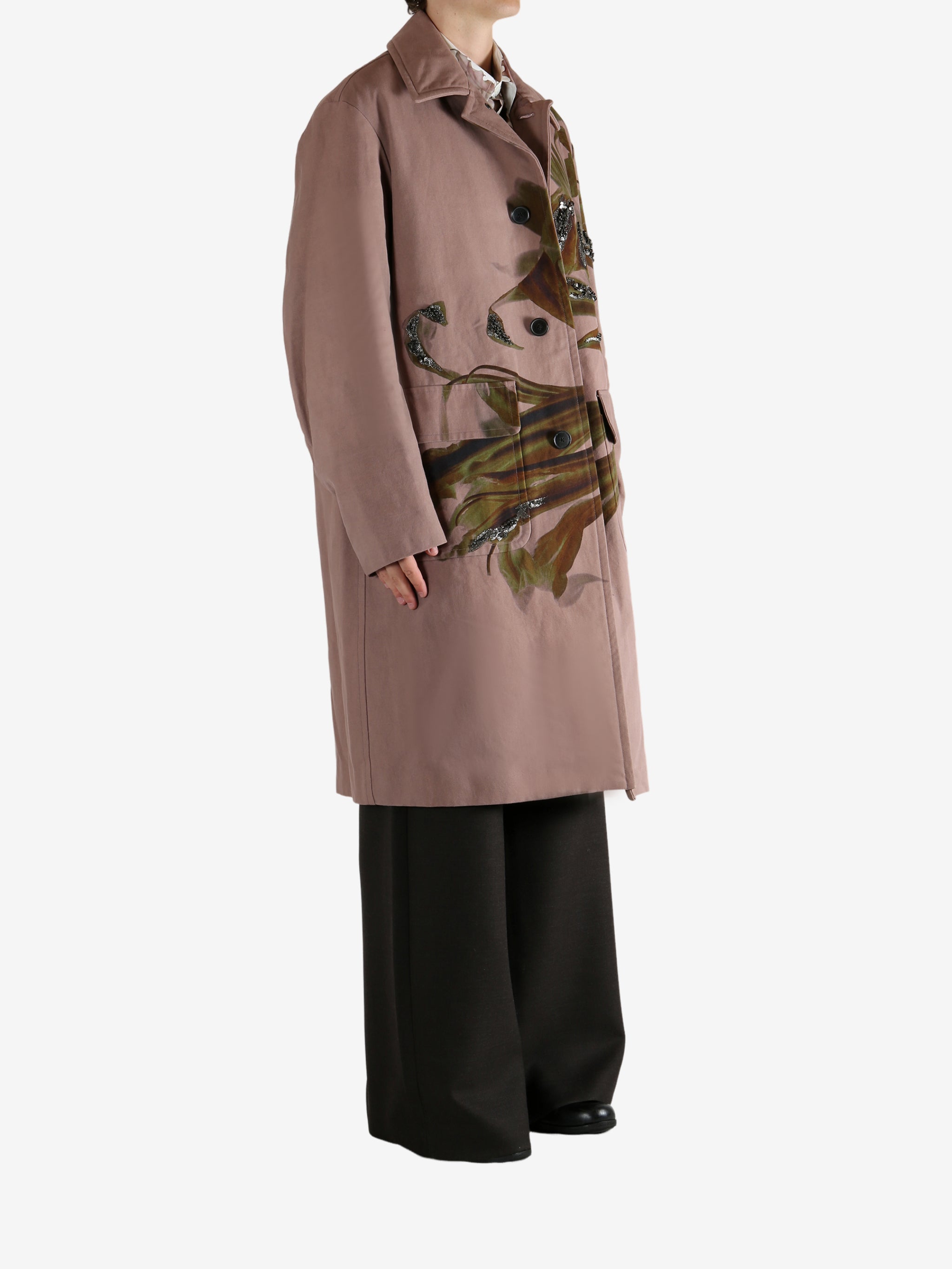 Pink coat worn by a person, showing the coat's fit