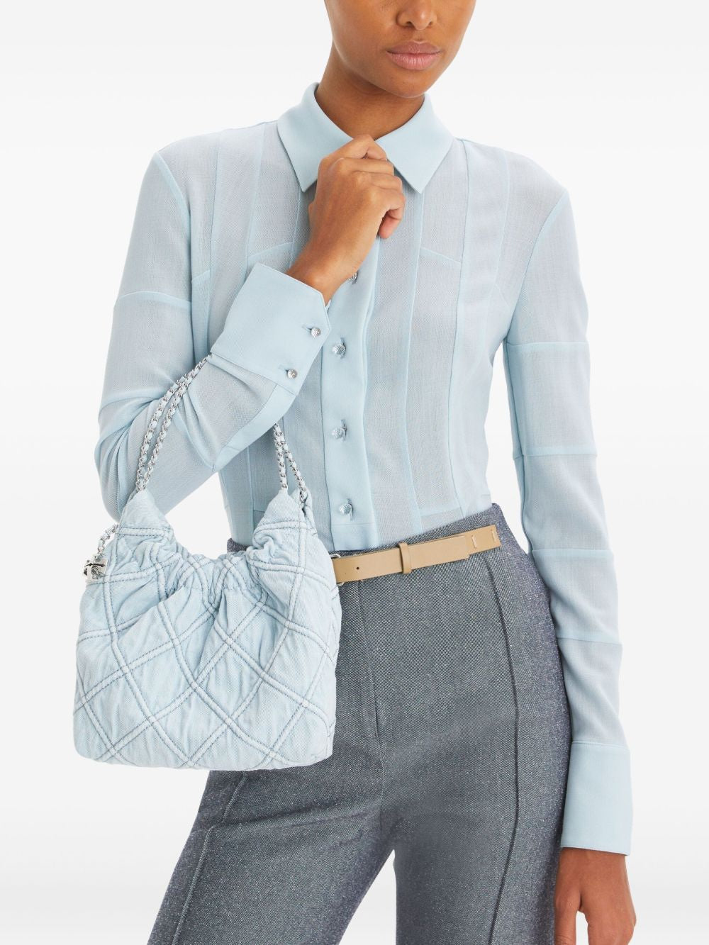 Blue bag carried by a person, showing the bag’s fit