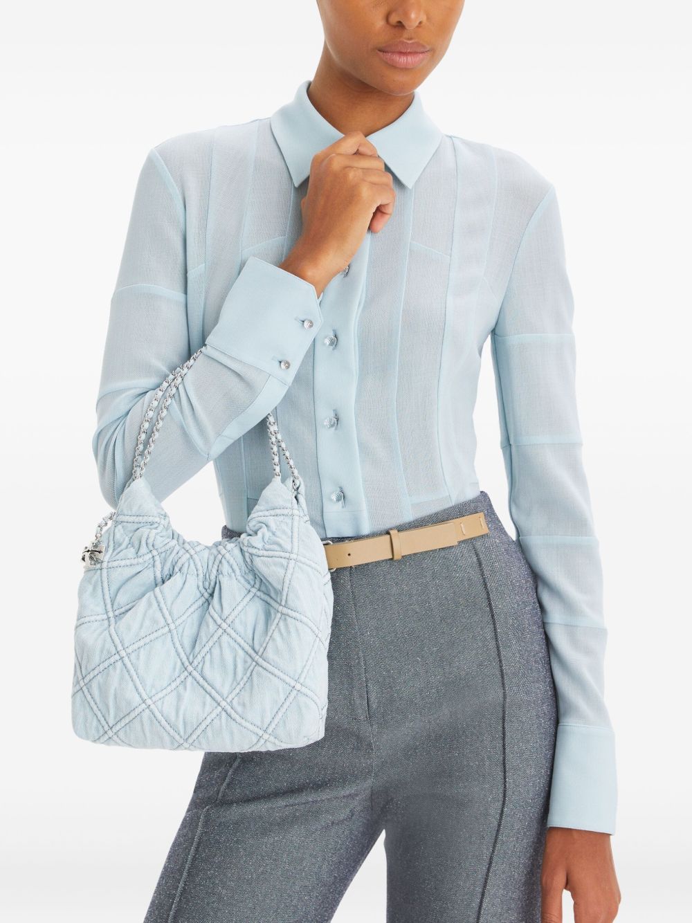 Blue bag carried by a person, showing the bag’s fit