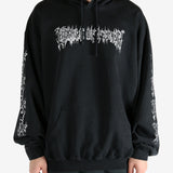 Black hoodie worn by a person, showing the hoodie's fit