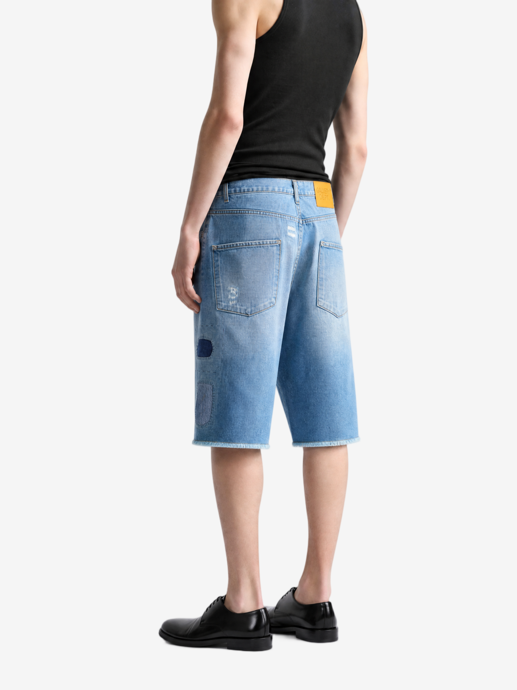 Blue shorts worn by a person, showing the shorts fit