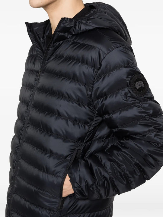 Black hoodie worn by a person, showing the hoodie fit