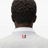 White knitwear worn by a person, showing the knitwear fit