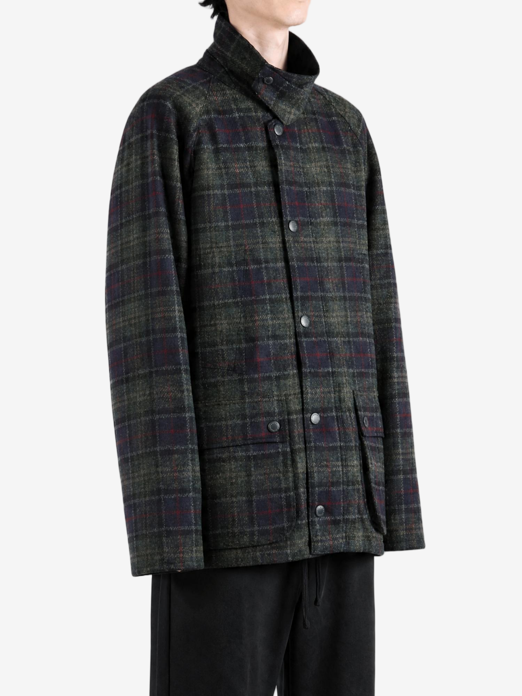 Green jacket worn by a person, showing the jacket fit
