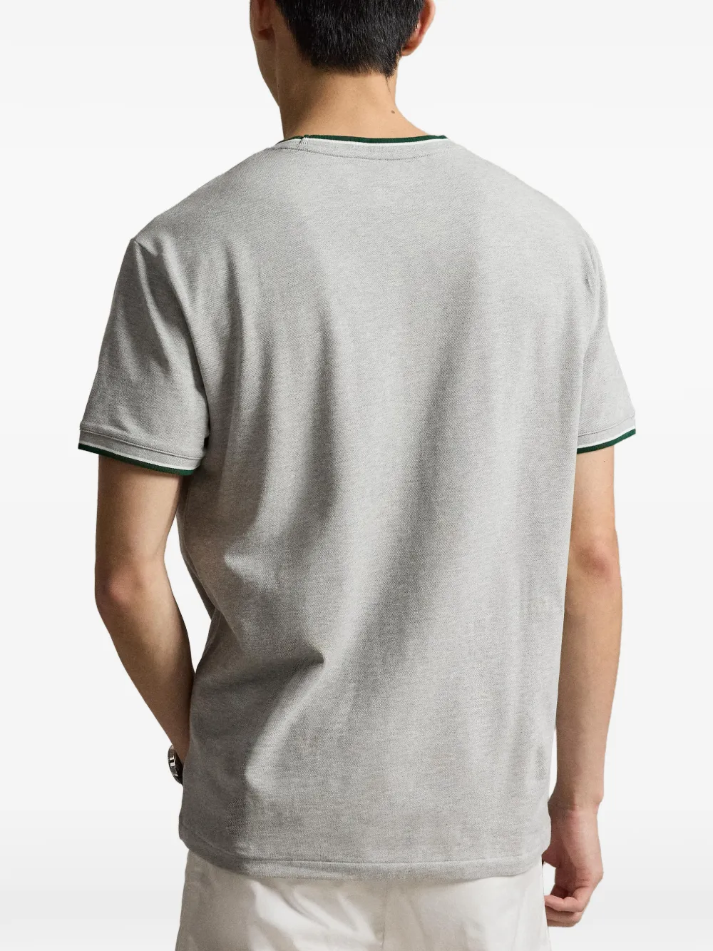 Grey t-shirt worn by a person, showing the t-shirt fit
