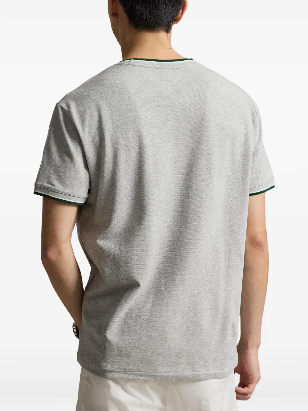 Grey t-shirt worn by a person, showing the t-shirt fit