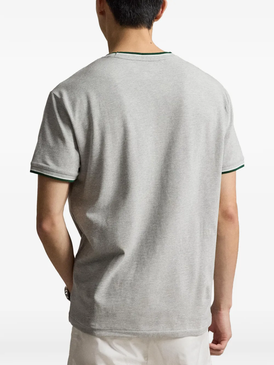 Grey t-shirt worn by a person, showing the t-shirt fit