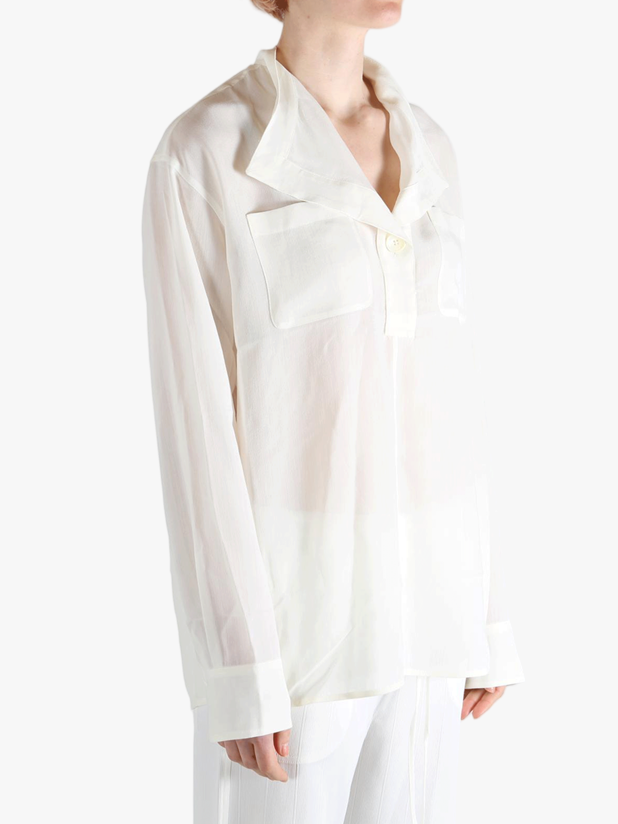 white shirts worn by a person, showing the shirts fit