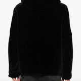 Black jacket worn by a person, showing the jacket's fit