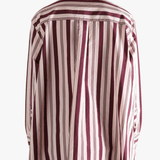 Red shirt worn by a person, showing the shirt's fit
