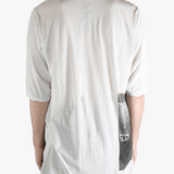 White t-shirt worn by a person, showing the t-shirt's fit