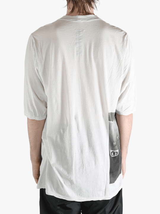 White t-shirt worn by a person, showing the t-shirt's fit